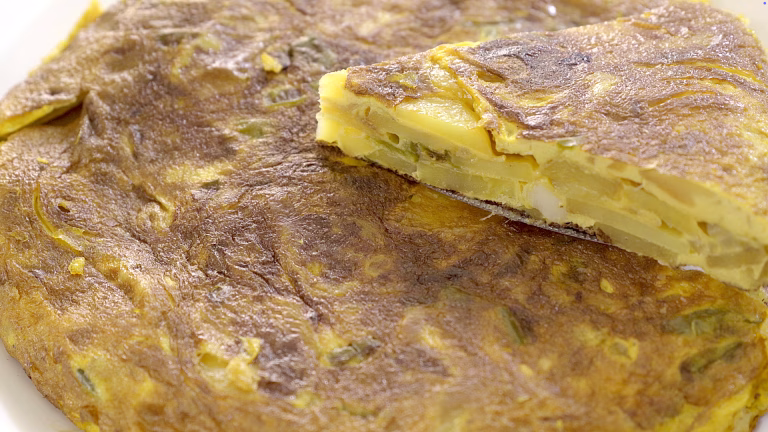 crispy omelet with potato pieces inside