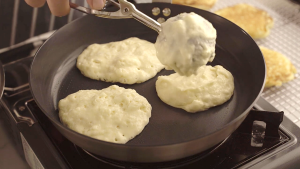 Golden pancake flipping in non-stick skillet