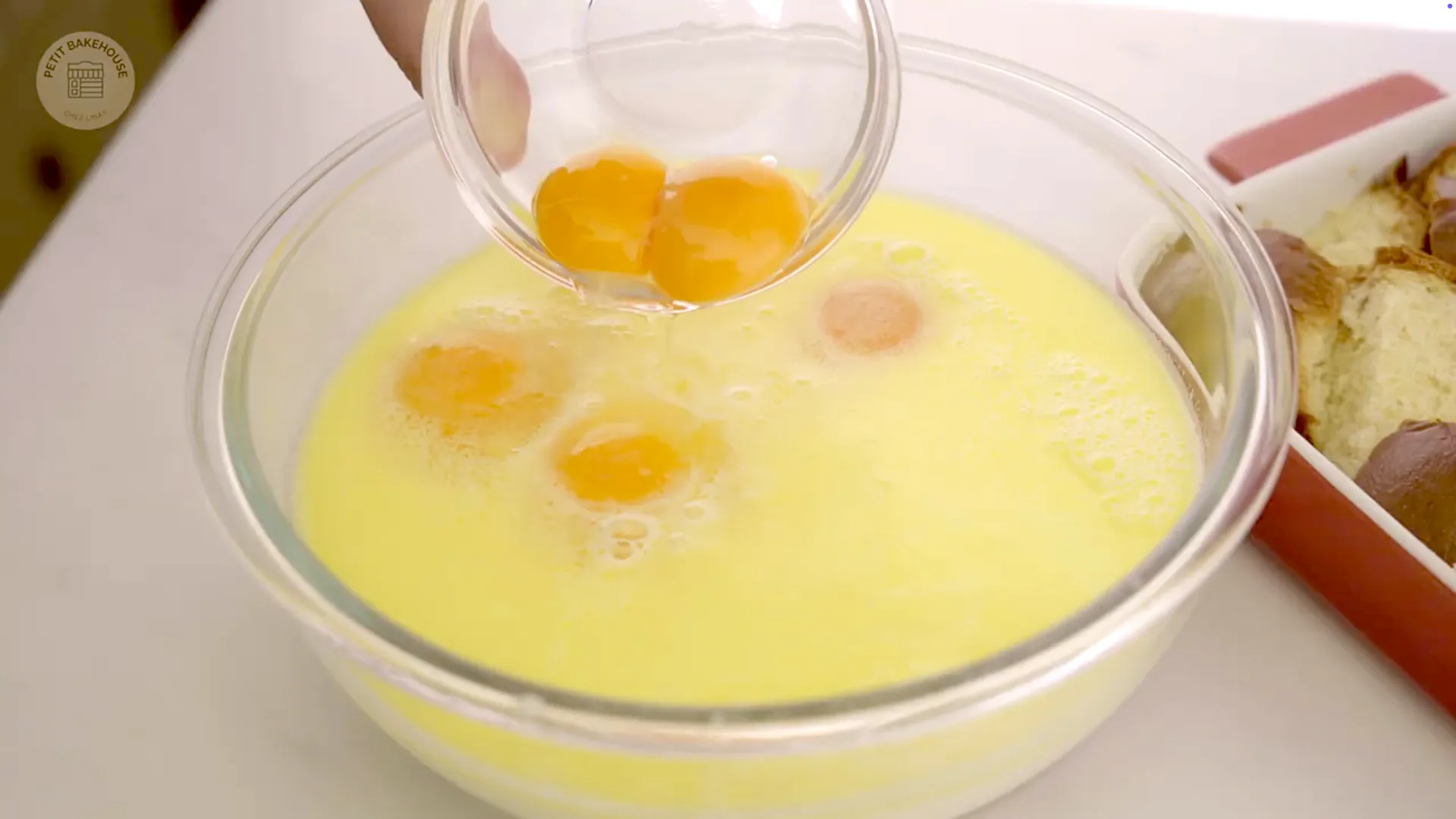 Close-up of eggs added to the milk and butter mixture